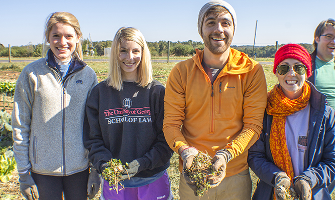 students volunteering for PILC service day at UGArden