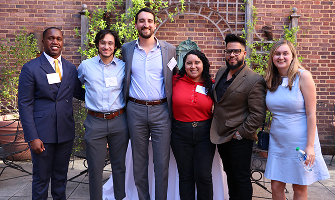 six students at a reception