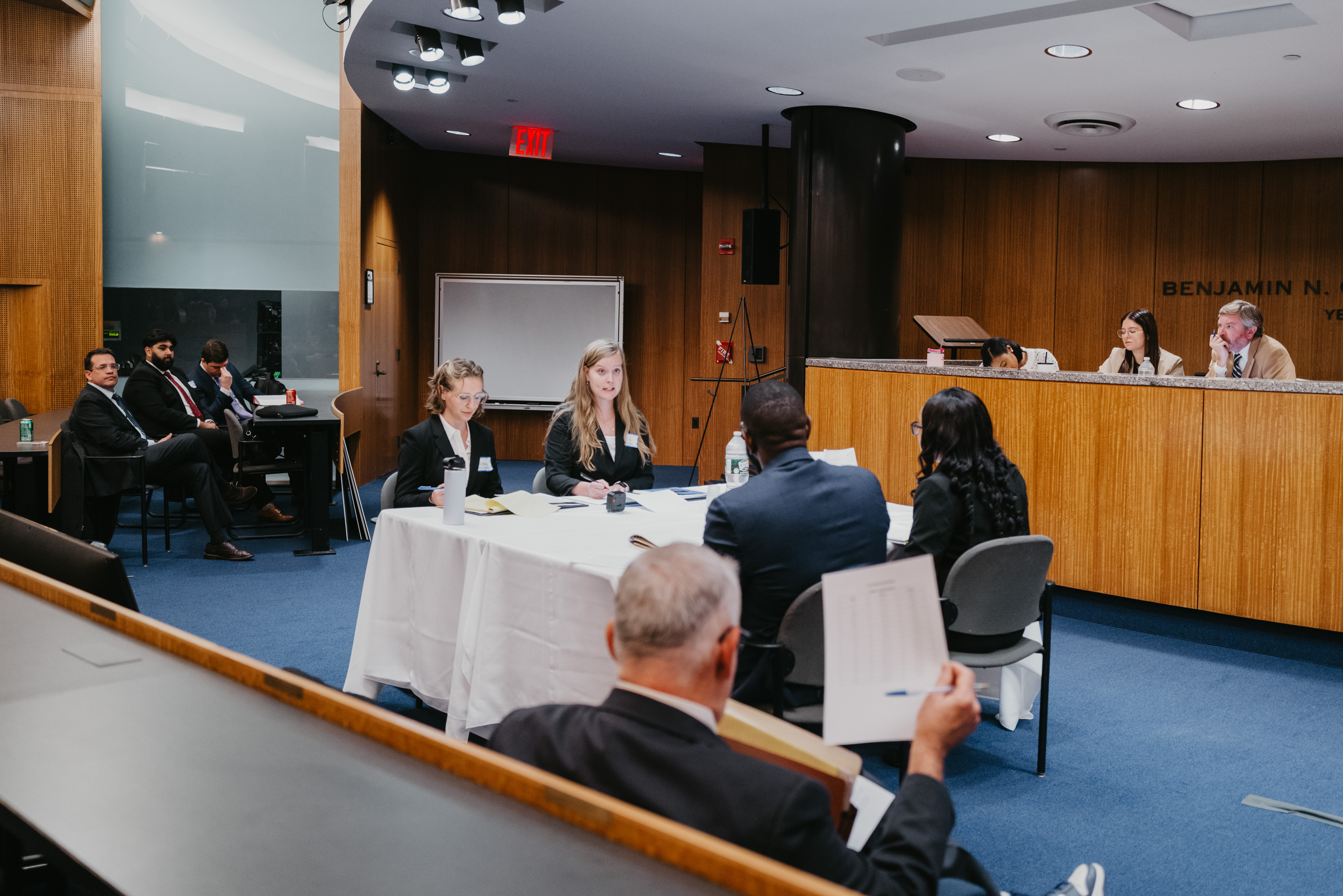 Students negotiating at a table.