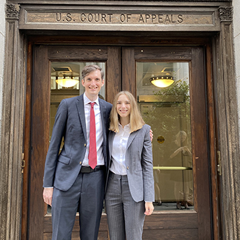 stokes and bailey in front of court
