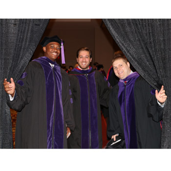 three graduates at UGA Law graduation