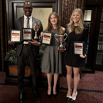 Garfield A. McIntyre Jr., Hannah N. Ryninger and Emily C. Wood with their trophies
