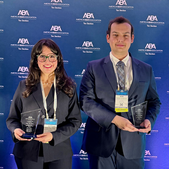 Image of the Gonzales and Anderson with their trophies